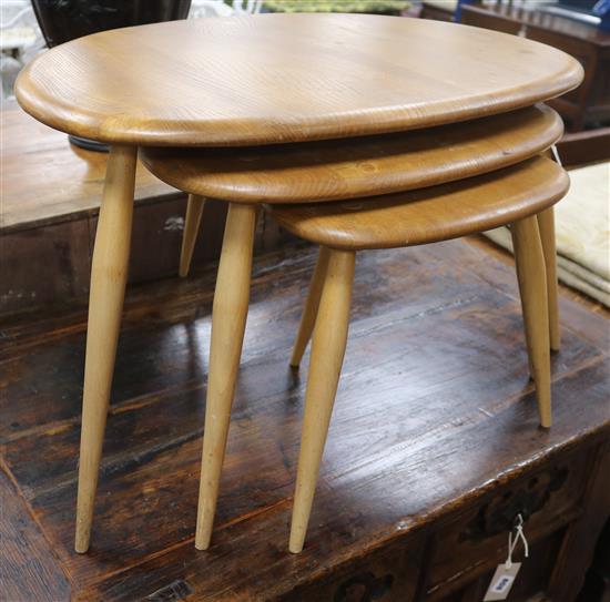 Three graduated Ercol Pebble tables W.66cm